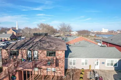 an aerial view of a house with a deck at Side-by-Side Family Apartments - Sleeps 15 Total in Huron