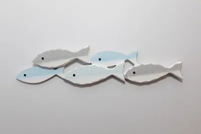 a group of three fish hanging on a wall at Side-by-Side Family Apartments - Sleeps 15 Total in Huron