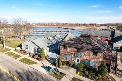 an aerial view of a house with a body of water at Side-by-Side Family Apartments - Sleeps 15 Total in Huron
