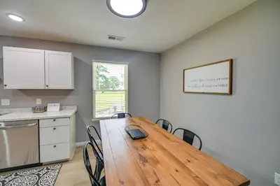 a kitchen with a wooden table and chairs in a room at Serene Dry Ridge Vacation Rental with Nearby Fishing in Dry Ridge