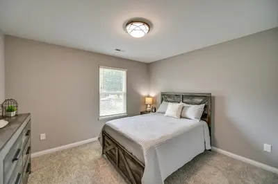 a bedroom with a bed and a window at Serene Dry Ridge Vacation Rental with Nearby Fishing in Dry Ridge