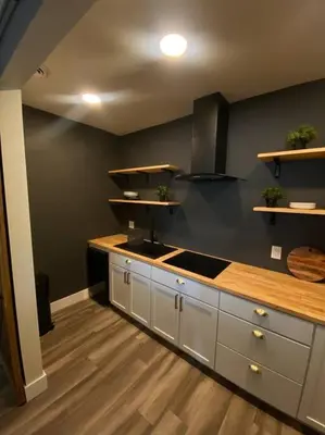 a kitchen with a sink and a counter top at Modern & Luxurious 1 Bedroom in the Heart of Short North in Columbus