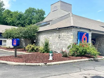 a church with a fire hydrant in front of a street at Studio 6 Suites Dayton OH Englewood in Dayton