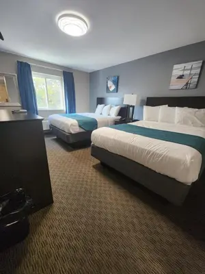 a hotel room with two beds and a window at Put-in-Bay Resort & Conference Center in Put-in-Bay