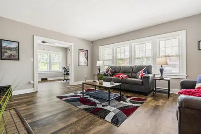 a living room with a couch and a table at Apartments in the Heart of Canton in Canton