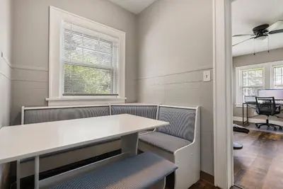 a waiting room with chairs and a table and a window at Apartments in the Heart of Canton in Canton
