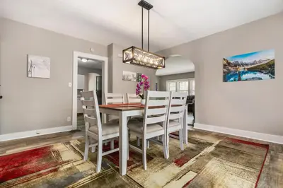 a dining room with a table and chairs at Apartments in the Heart of Canton in Canton