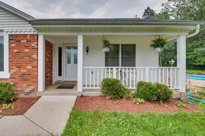 a house with a white fence and a porch at Pet-Friendly Union Vacation Rental with Pool! in Union