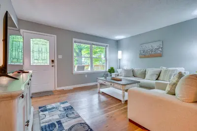 a living room with a couch and a table at Outdoor Entertainment Areas Family Ohio Getaway in Howard