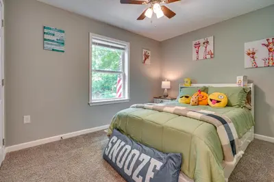 a bedroom with a bed with two stuffed animals on it at Outdoor Entertainment Areas Family Ohio Getaway in Howard