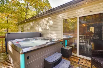 a hot tub on the back of a house at Outdoor Entertainment Areas Family Ohio Getaway in Howard
