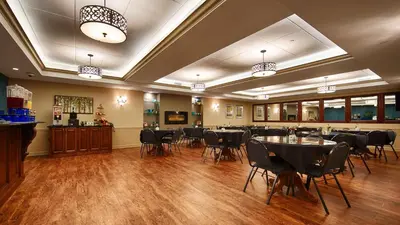 a restaurant with tables and chairs in a room at Best Western Plus Mentor-Cleveland Northeast in Mentor
