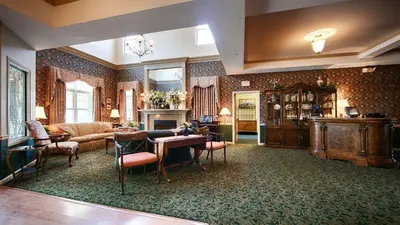 a living room with a couch and a table at Best Western Plus Mentor-Cleveland Northeast in Mentor