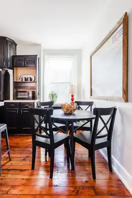 a dining room with a table and chairs in a kitchen at 2 Large Apts w Parking - Downtown Over the Rhine in Cincinnati