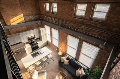 an overhead view of a living room and kitchen in a loft at Entire Historic Building Sleeps 30 in Cincinnati