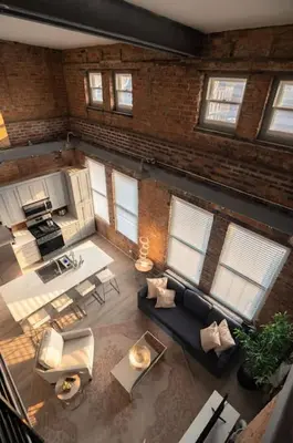 an overhead view of a living room with a brick wall at BUBBLES FANTASY SUITE Explore OTR and Rhinegeist in Cincinnati
