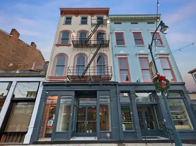 a building on the corner of a street at Over the Rhine Luxury MicroSuite On Findlay Market in Cincinnati