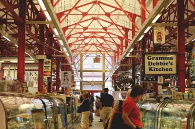 a group of people walking around a store at Findlay Suites Explore OTR with an Outdoor Deck in Cincinnati
