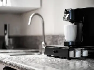 a coffee maker sitting on top of a kitchen counter at Cozy OTR Home with Private Roof Deck in Cincinnati