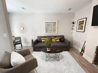 a living room with a couch and a table at Full Building Huge Downtown Retreat Walkable to Everything in Cincinnati