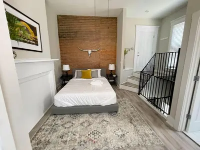 a bedroom with a bed in the middle of a room at Quiet 1-Bedroom Loft near Entertainment District in Cincinnati