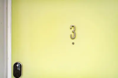 a green door with a number three on it at Mt Adams 1BR Great Location Steps from Monastery in Cincinnati