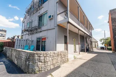 a building with two blue chairs in front of it at Mt Adams 1BR Great Location Steps from Monastery in Cincinnati