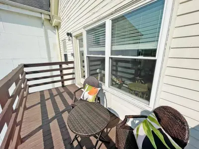a patio with a table and chairs on a porch at Lovely 2bd in Mount Adams near Downtown and OTR in Cincinnati