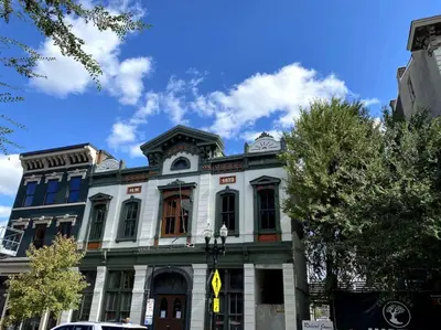 a large white building on a city street at WALK TO ALL in Over The Rhine Cincinnati in Cincinnati