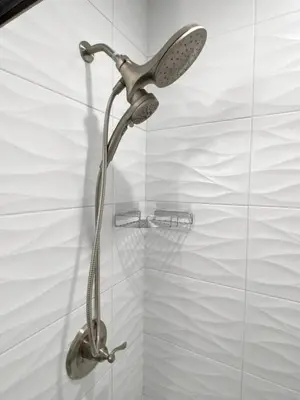 a shower with a shower head in a bathroom at SWIZZLE Explore OTR and Downtown from Rhinegeist in Cincinnati
