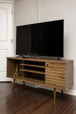 a large entertainment center with a flat screen tv on it at Stunning 2BR Apartment Near Downtown in Cincinnati
