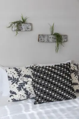 two plants on the wall above a couch at Deluxe 6 Bedroom 3 Min to Downtown w 2-car Driveway in Cincinnati