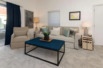 a living room with a couch and a table at Adorable MtAdams 2BR near it all in Cincinnati