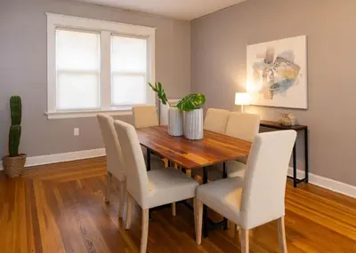 a dining room with a wooden table and chairs at Hyde Park Comfort Near Rookwood in Cincinnati