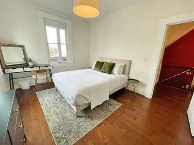 a bedroom with a white bed and a piano at Walk to Rhinegeist, Findlay Market, FREE Streetcar in Cincinnati