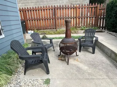 a patio with two chairs and a grill with two chairs at Walk to Rhinegeist, Findlay Market, FREE Streetcar in Cincinnati