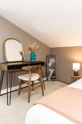 a bedroom with a dressing table and a mirror at Walk to Rhinegeist, Findlay Market, FREE Streetcar in Cincinnati