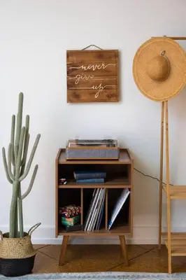 a table with a cactus and a sign on the wall at Deluxe 3BR Loft Walkable to Everything Downtown in Cincinnati