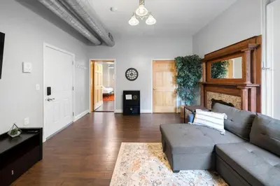 a living room with a couch and a table at City Escape 2BR Steps to TQL near OTR and Downtown in Cincinnati