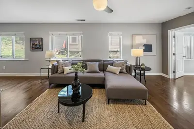 a living room with a couch and a table at Comfortable 2BR Condo near City Center in Cincinnati