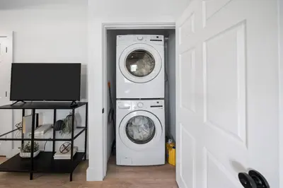 a white washer and dryer in a room at Spacious and Modern 3BR near Downtown and Walnut Hills in Cincinnati