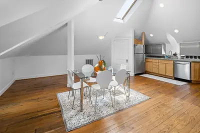 a dining room with a table and chairs in a kitchen at Hyde Park Penthouse with Private Patio in Cincinnati
