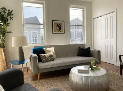 a living room with a couch and a coffee table at Explore Downtown from Adorable Mount Adams in Cincinnati
