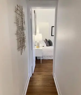 a hallway leading to a bedroom with a bed at Explore Downtown from Adorable Mount Adams in Cincinnati