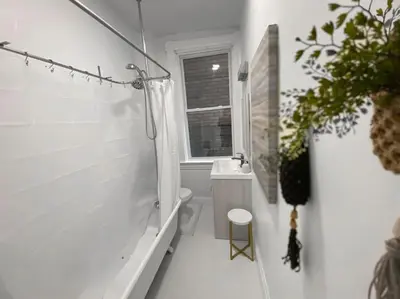 a bathroom with a tub and a toilet and a sink at Explore Downtown from Adorable Mount Adams in Cincinnati