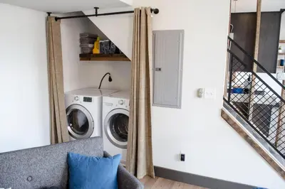 a laundry room with a washer and dryer at Gorgeous Condo in the Heart of OTR Free Parking in Cincinnati