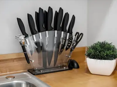 a bunch of knives in a knife holder on a counter at Cozy 1BR Near Zoo, UC, OTR, Downtown in Cincinnati
