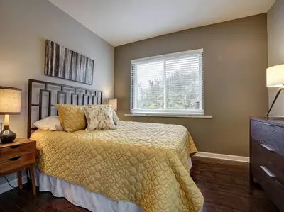 a bedroom with a bed and a window at Bright 2BR near downtown in Cincinnati