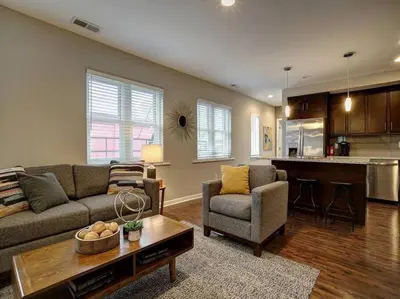 a living room with a couch and a table at Bright 2BR near downtown in Cincinnati