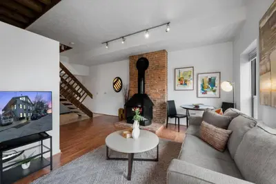 a living room with a couch and a table at Stylish Mt Adams 1BR in great location in Cincinnati